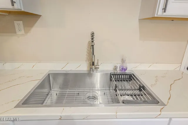 a kitchen with stainless steel appliances a refrigerator and a stove