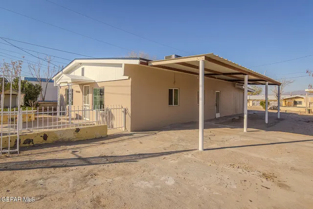 a view of a balcony with furniture