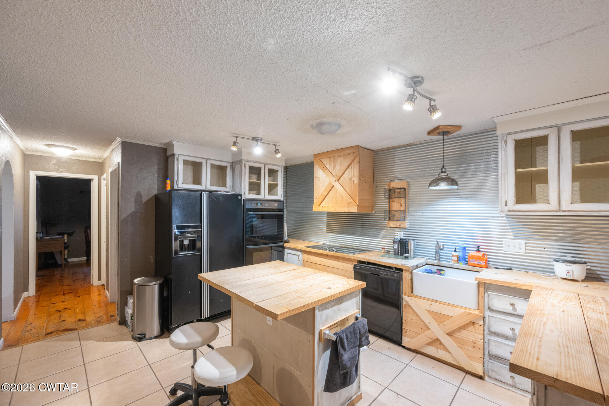 101 Red Ribbon Road Westport, TN 38387 - Photo 17 of 51 a kitchen that has a lot of cabinets a sink and a refrigerator in it