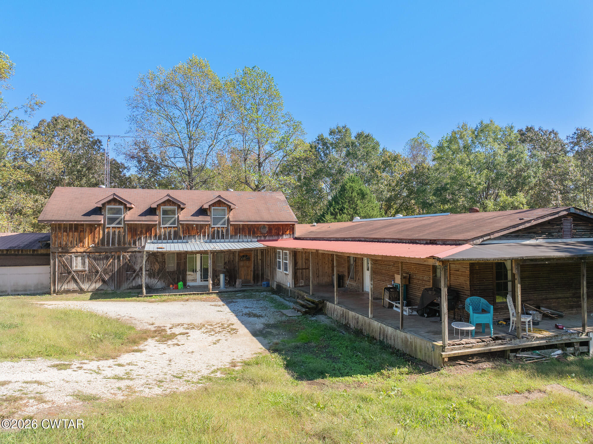 101 Red Ribbon Road Westport, TN 38387 - Photo 2 of 51 a view of a house with swimming pool and a chairs
