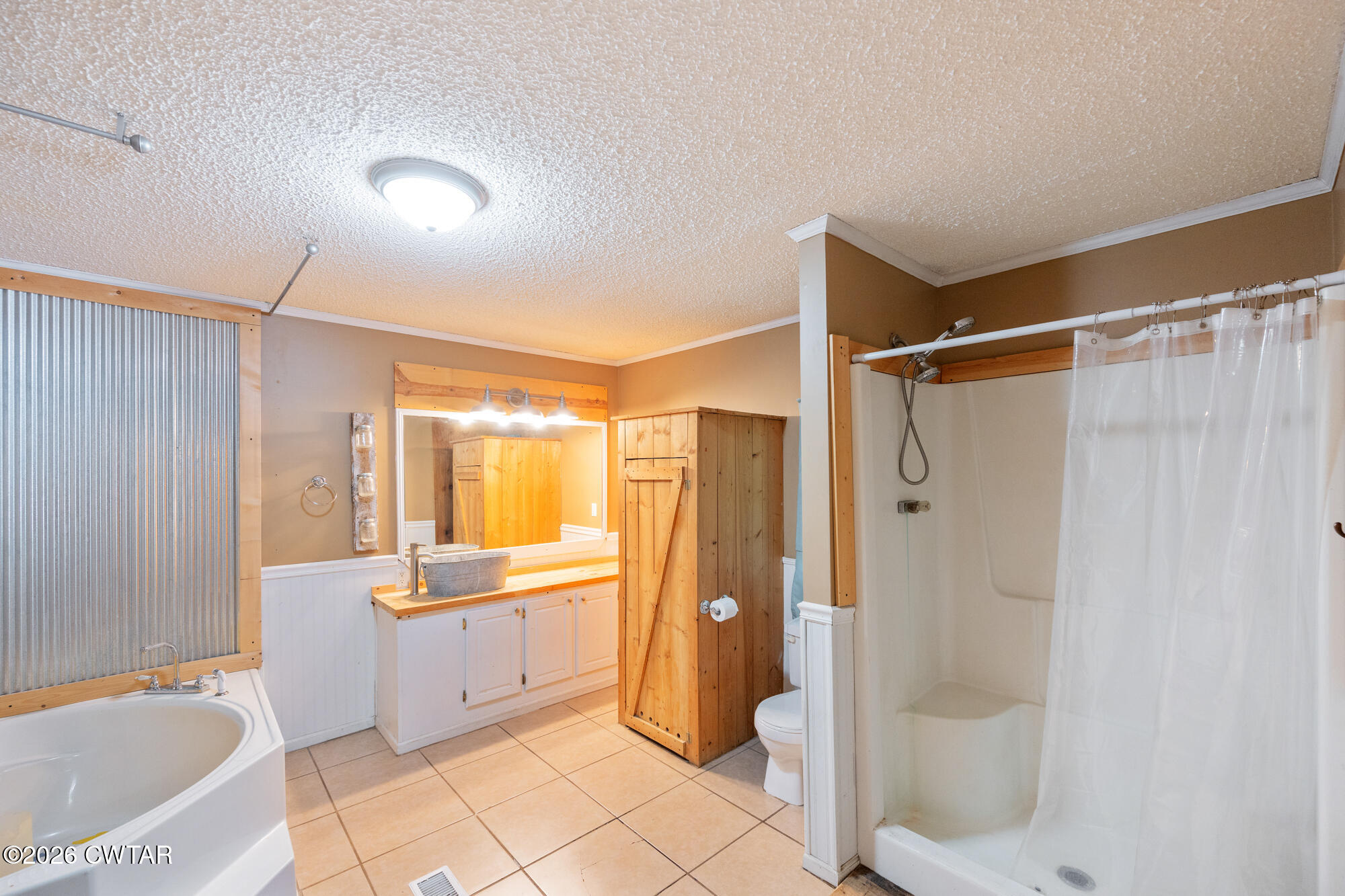 101 Red Ribbon Road Westport, TN 38387 - Photo 21 of 51 a bathroom with a granite countertop shower a sink and a bathtub