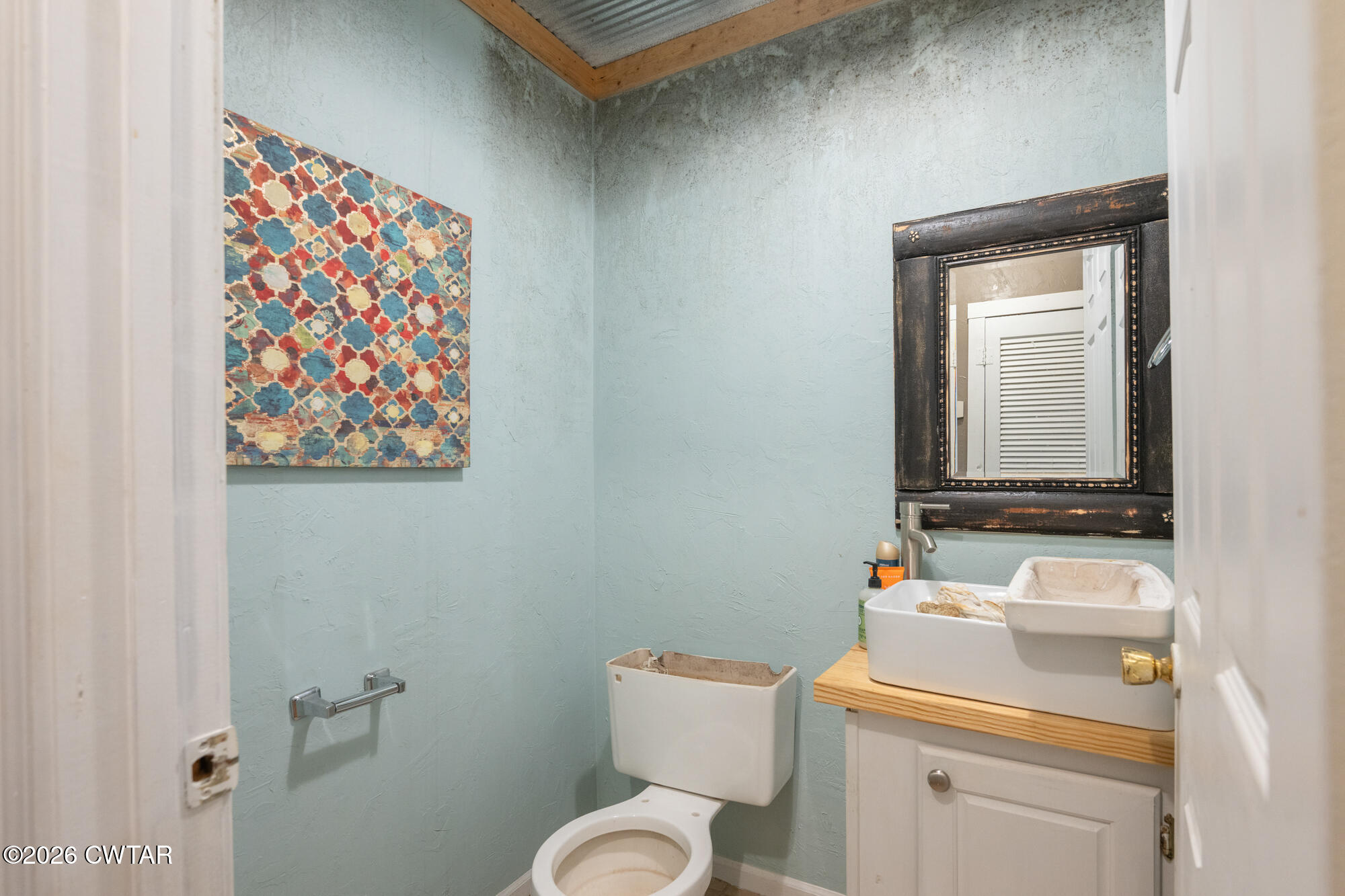 101 Red Ribbon Road Westport, TN 38387 - Photo 23 of 51 a bathroom with a toilet a sink and a mirror