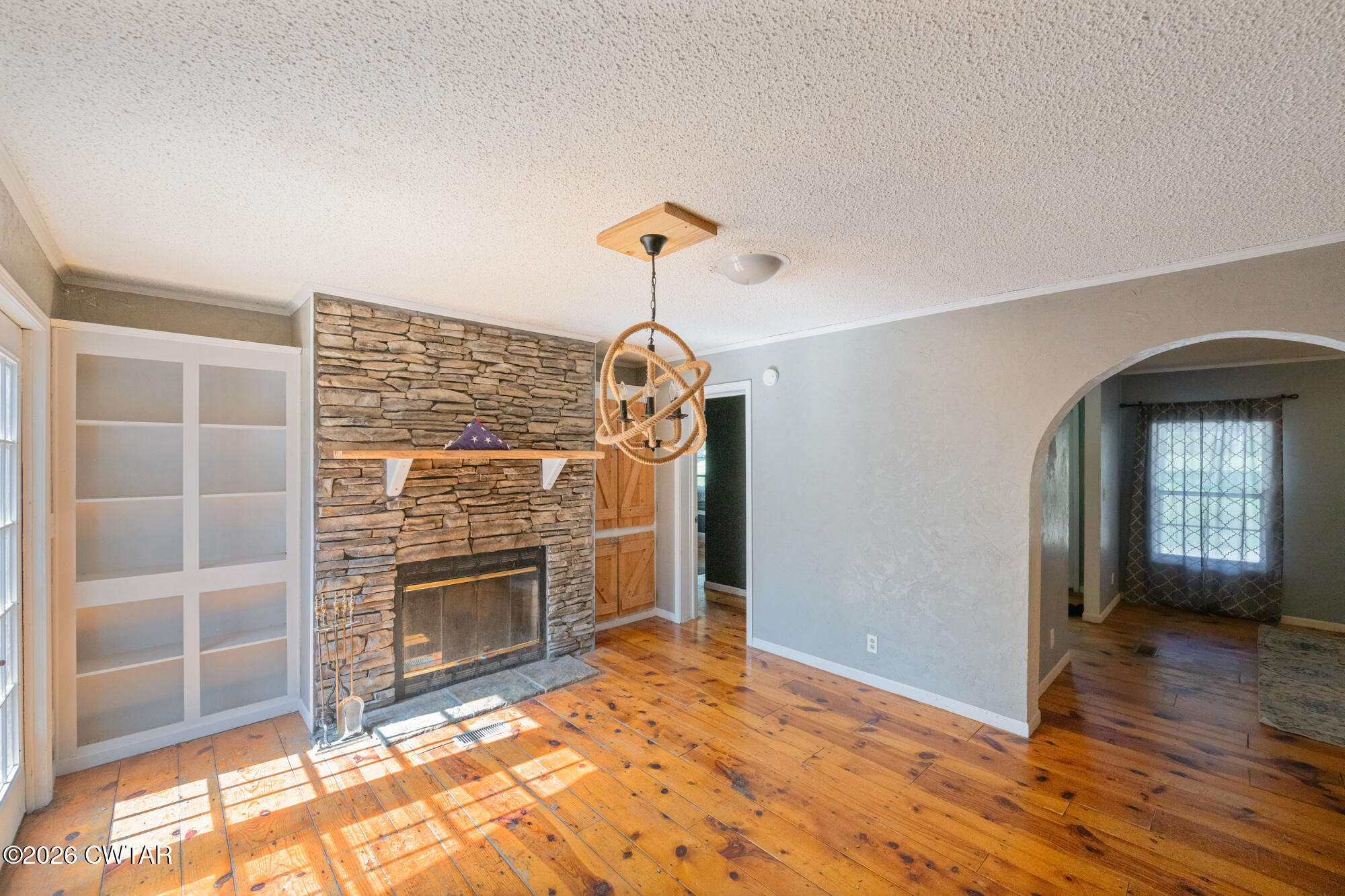 101 Red Ribbon Road Westport, TN 38387 - Photo 25 of 51 a view of empty room with wooden floor and fireplace