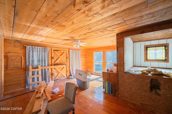 a living room with patio furniture