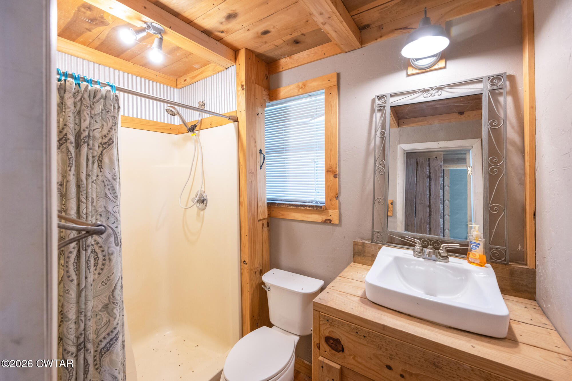 101 Red Ribbon Road Westport, TN 38387 - Photo 48 of 51 a bathroom with a sink and a mirror