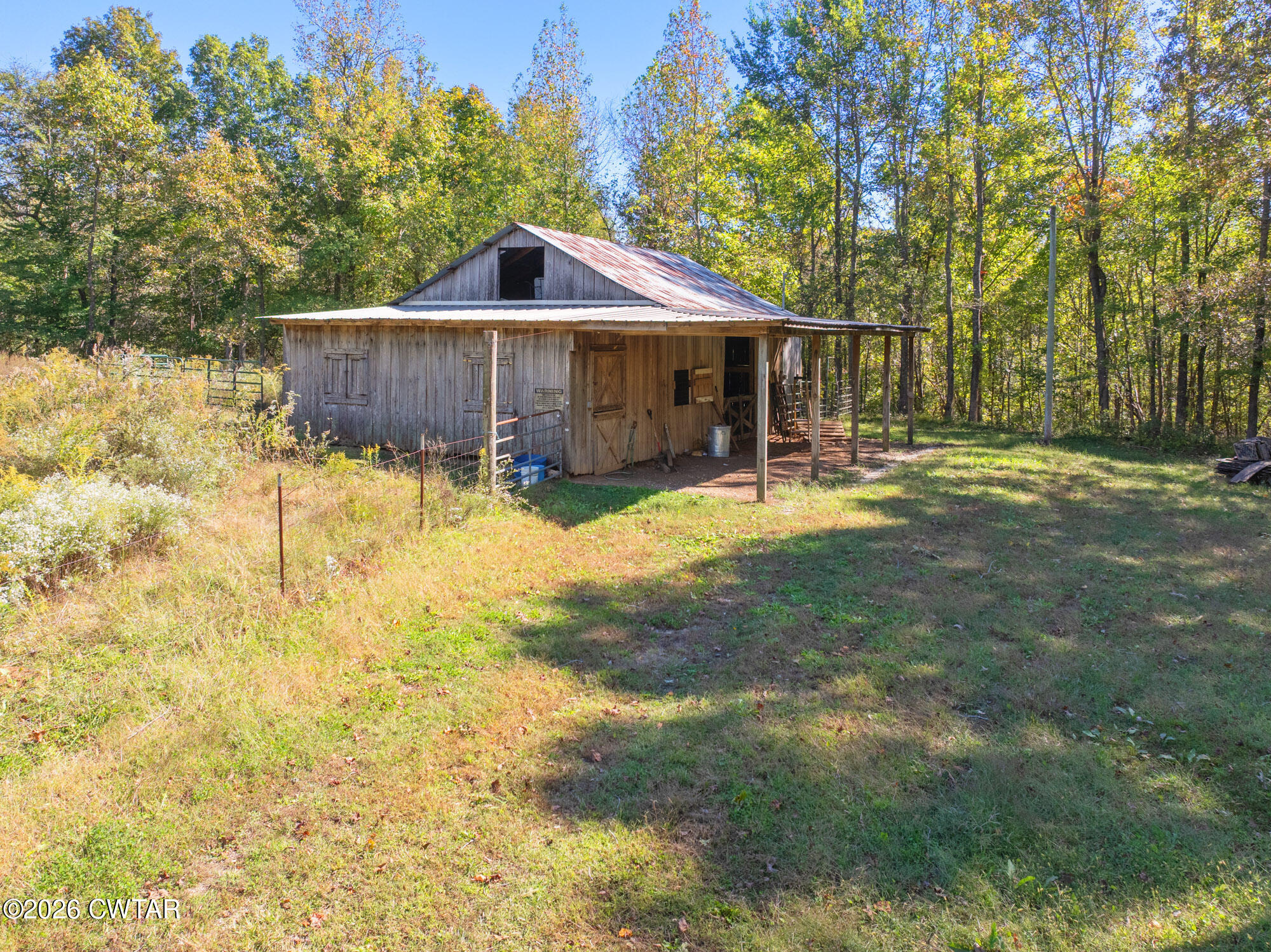 101 Red Ribbon Road Westport, TN 38387 - Photo 49 of 51 a view of a house with a yard