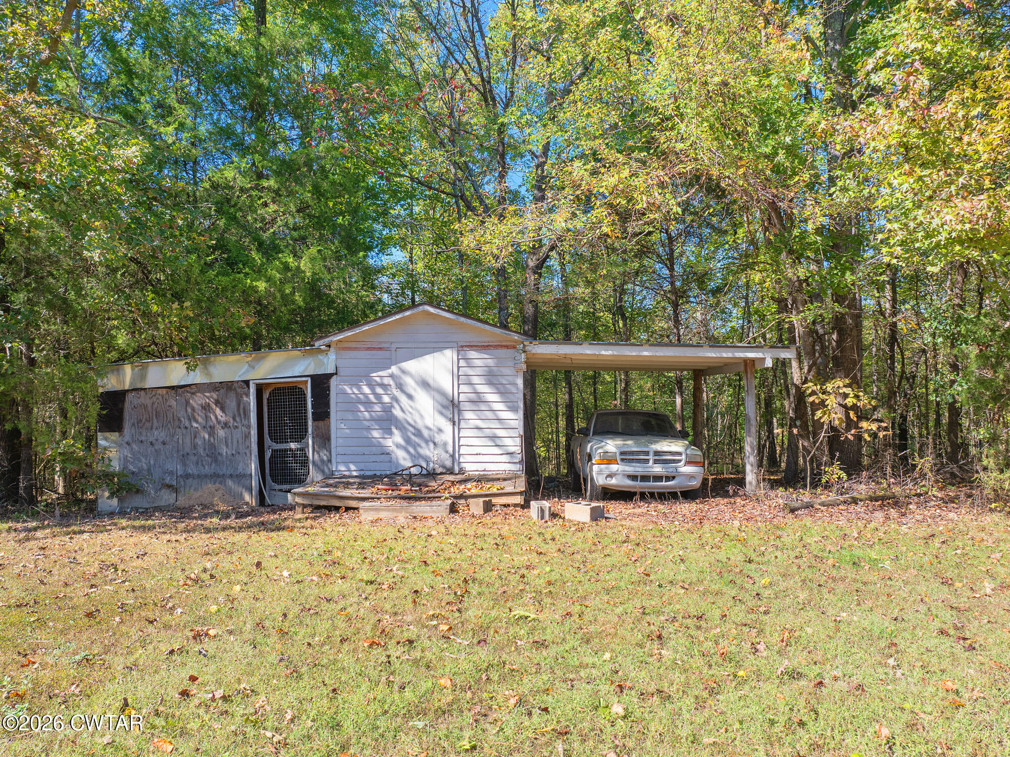 101 Red Ribbon Road Westport, TN 38387 - Photo 6 of 51 a view of a house with a yard covered in snow