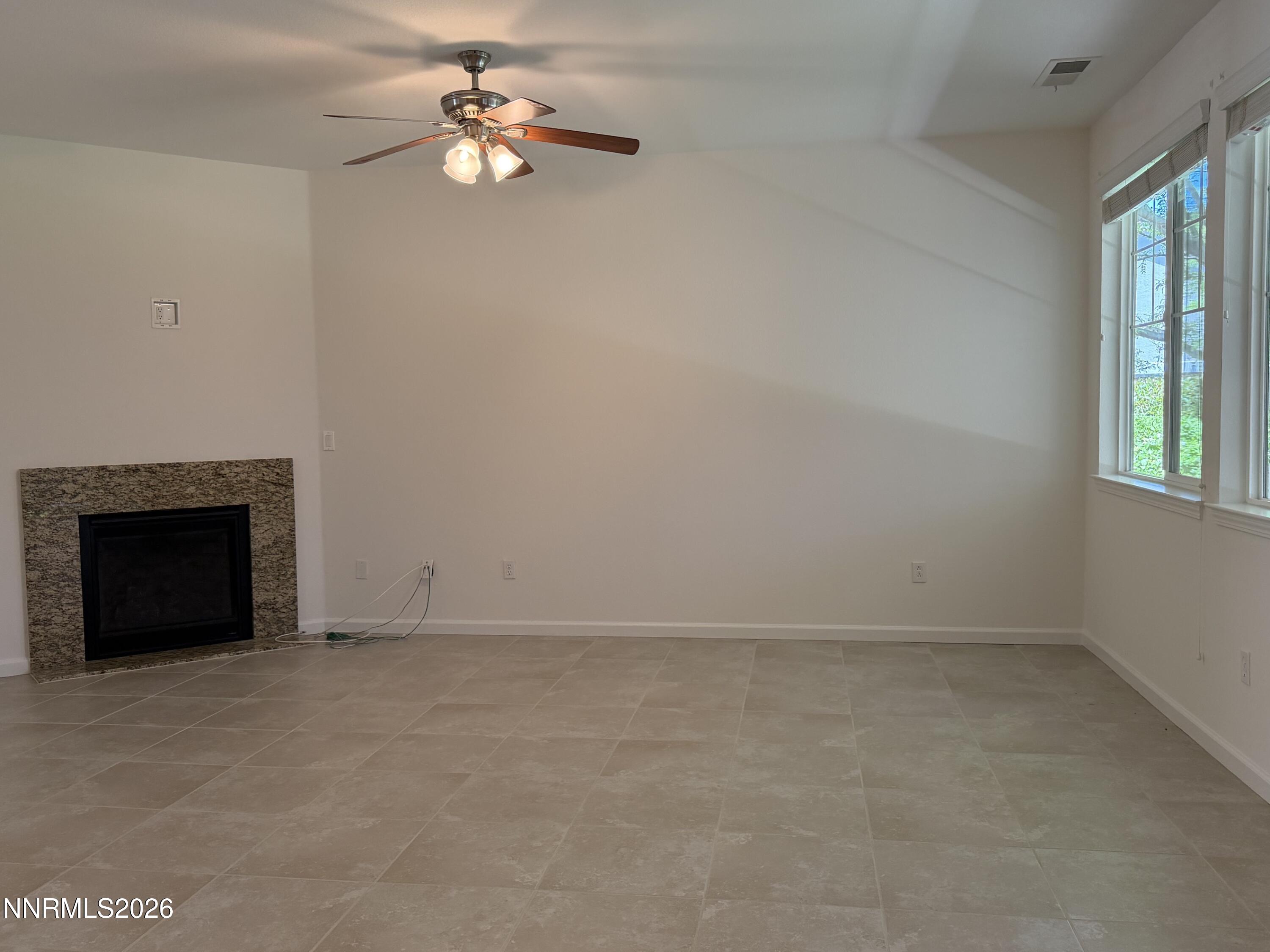 10890 Oakhaven Drive Reno, NV 89521 - Photo 7 of 28 wooden floor in an empty room with a window