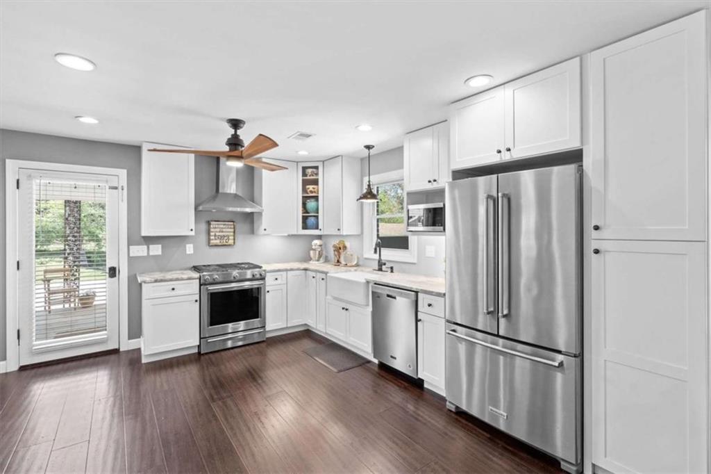 522 Hickory Street Bremen, GA 30110 - Photo 15 of 64 a kitchen with granite countertop white cabinets and white stainless steel appliances