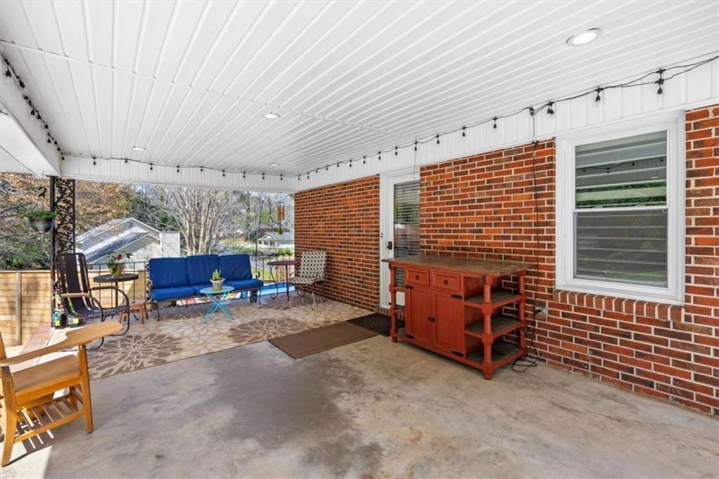 522 Hickory Street Bremen, GA 30110 - Photo 27 of 64 a view of a porch with a table and chairs