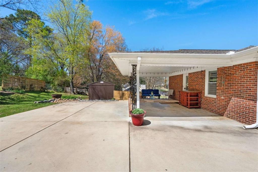 522 Hickory Street Bremen, GA 30110 - Photo 28 of 64 a view of a patio with table and chairs