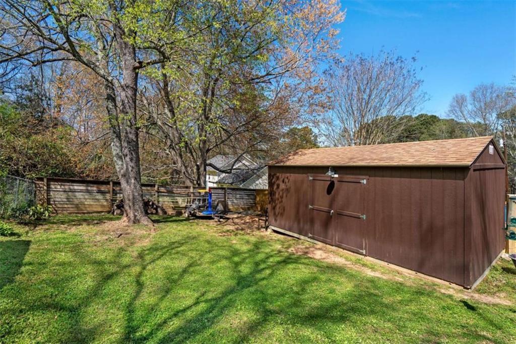 522 Hickory Street Bremen, GA 30110 - Photo 29 of 64 a view of backyard with wooden fence and trees