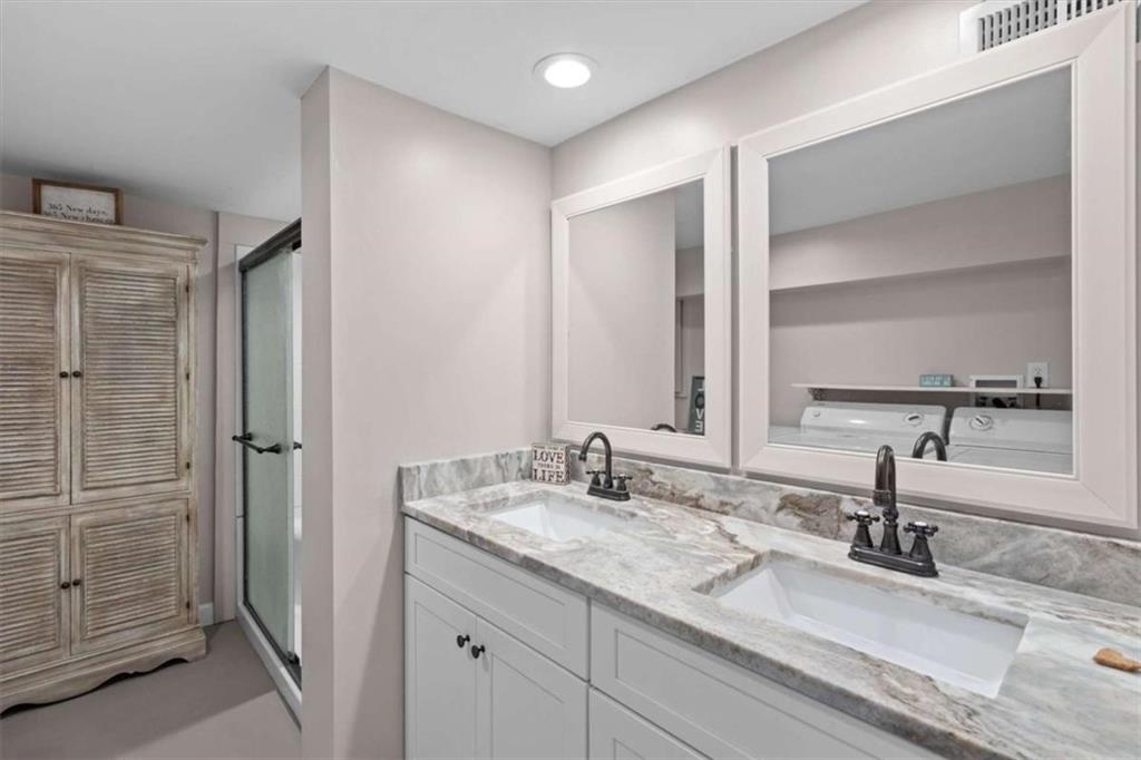 522 Hickory Street Bremen, GA 30110 - Photo 44 of 64 a bathroom with a double vanity sink and a mirror