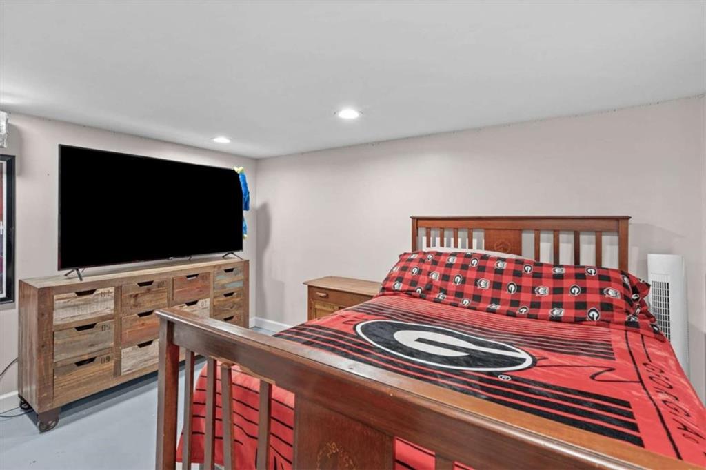 522 Hickory Street Bremen, GA 30110 - Photo 50 of 64 a bedroom with furniture and flat screen tv