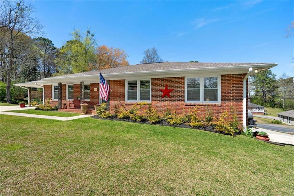 522 Hickory Street Bremen, GA 30110 - Photo 59 of 64 a view of a house with a backyard and a patio