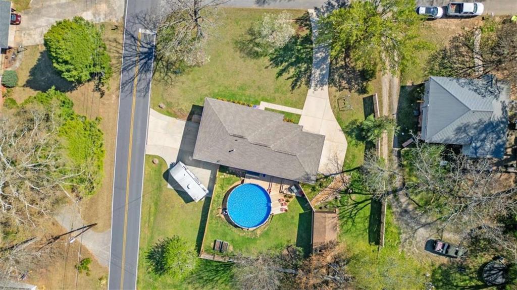 522 Hickory Street Bremen, GA 30110 - Photo 60 of 64 an aerial view of a house with swimming pool and large trees