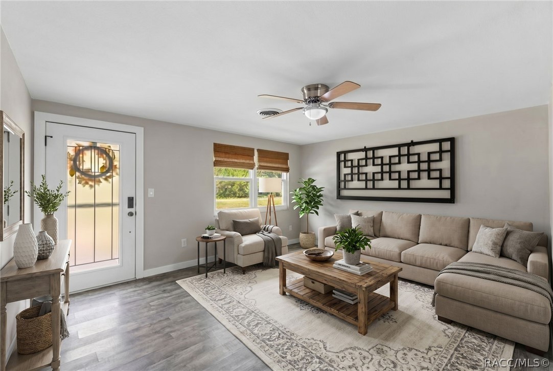 107 Allen Avenue Inglis, FL 34449 - Photo 5 of 36 a living room with furniture and a large window