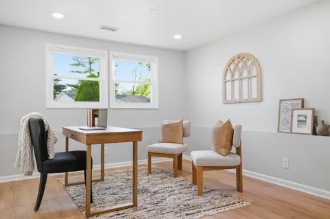 a view of a workspace with furniture