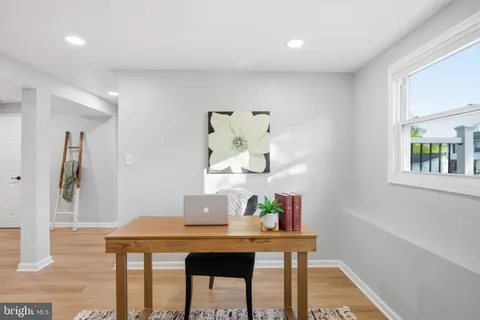 a living room with furniture and window