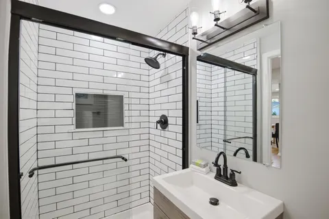 a bathroom with a sink and a mirror