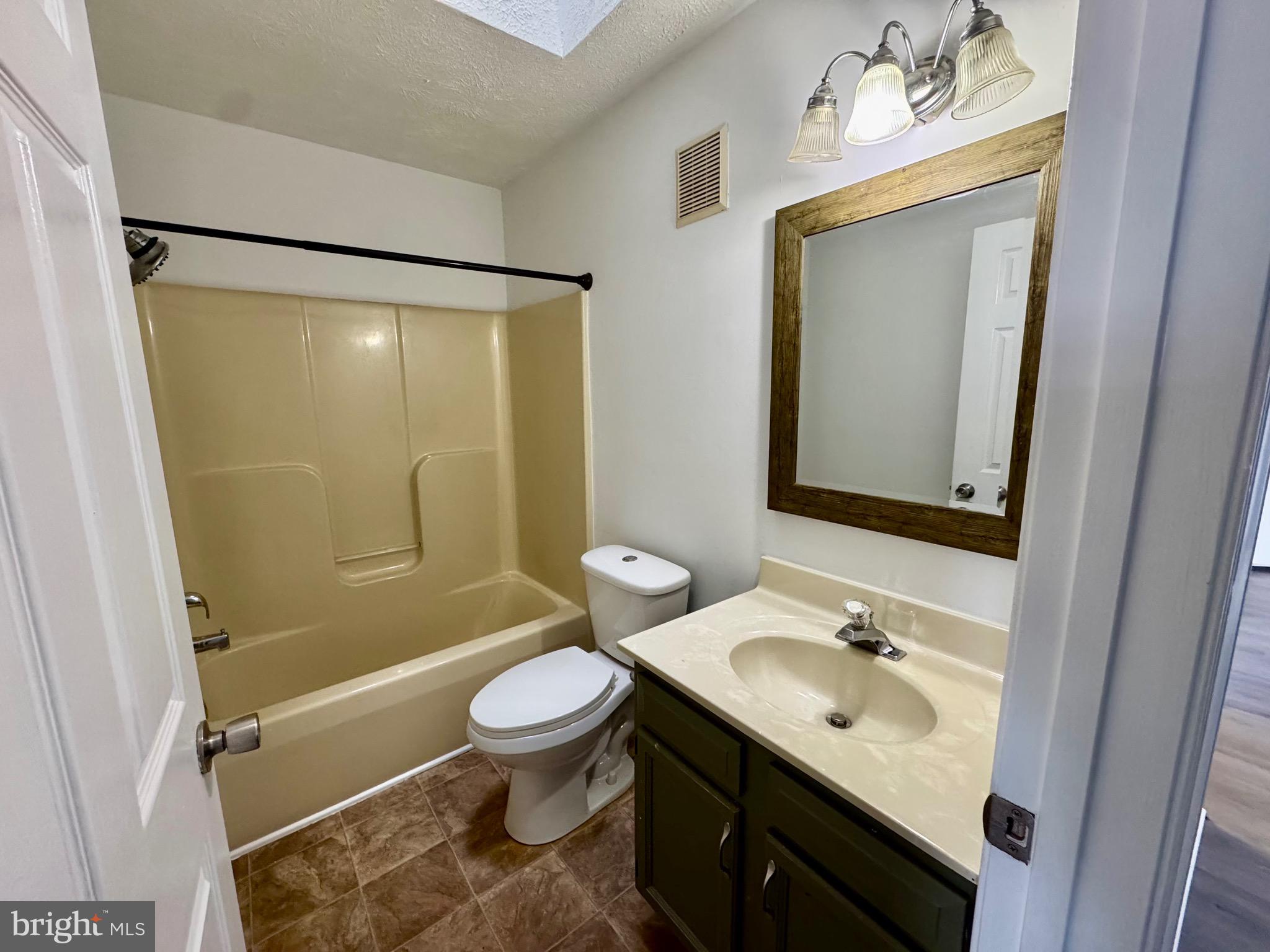 1290 South Ox Road Woodstock, VA 22664 - Photo 8 of 13 a bathroom with a sink toilet tub and shower