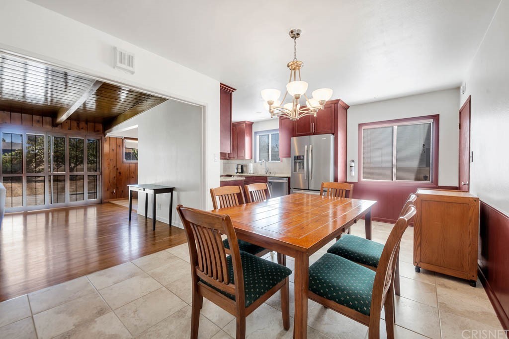 18649 Willard Street Reseda, CA 91335 - Photo 13 of 38 a dining room with furniture and wooden floor