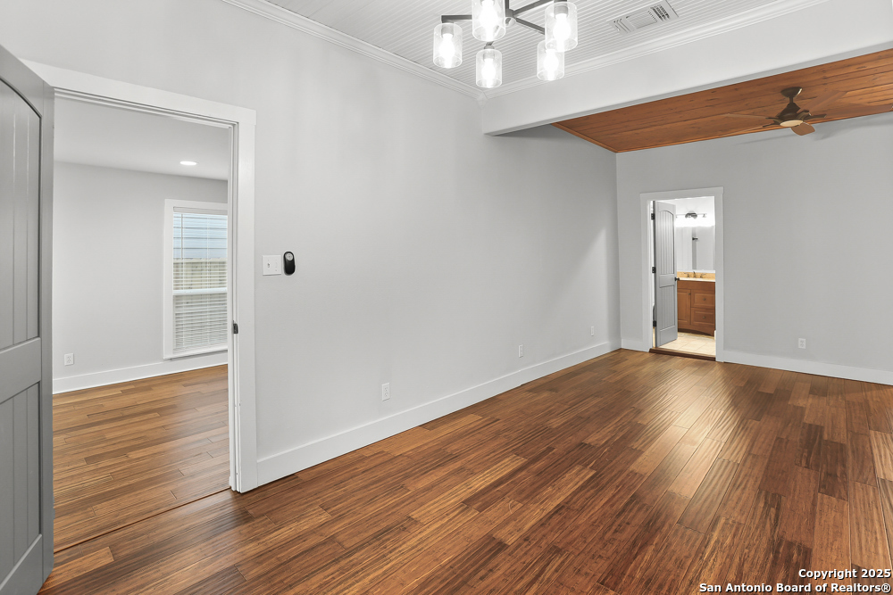 138 Perry Court, Unit 2 San Antonio, TX 78209 - Photo 17 of 29 wooden floor in an empty room with a window