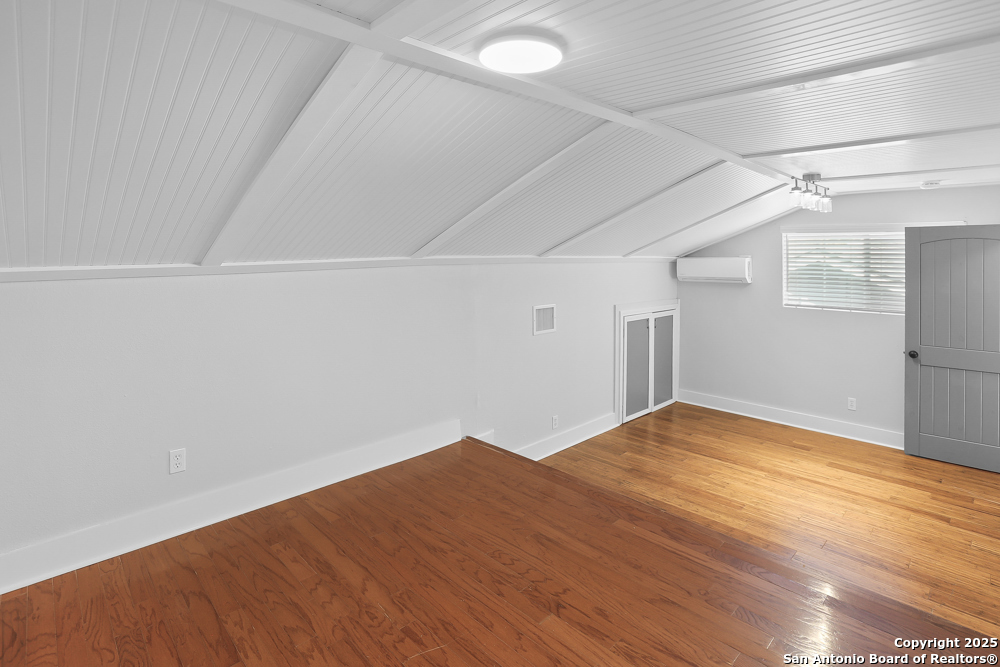 138 Perry Court, Unit 2 San Antonio, TX 78209 - Photo 23 of 29 a view of empty room with wooden floor