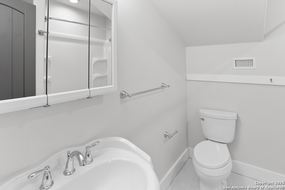 138 Perry Court, Unit 2 San Antonio, TX 78209 - Photo 25 of 29 a bathroom with a sink and a toilet