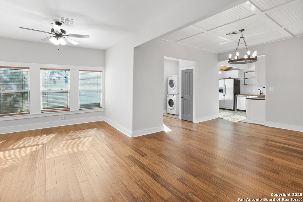 138 Perry Court, Unit 2 San Antonio, TX 78209 - Photo 6 of 29 a view of empty room with wooden floor and fan