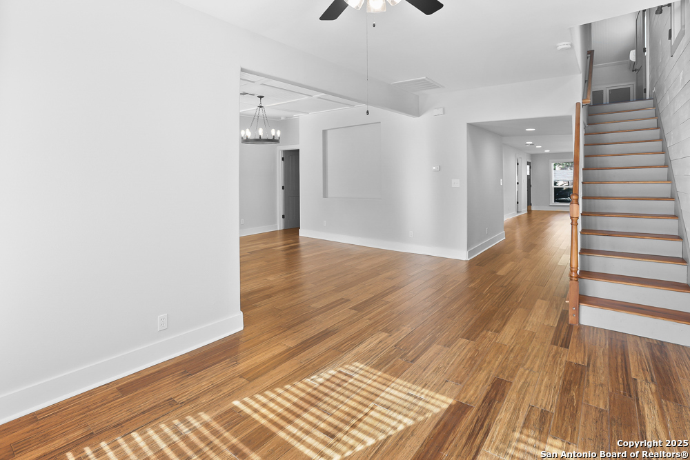 138 Perry Court, Unit 2 San Antonio, TX 78209 - Photo 8 of 29 a view of a hallway with wooden floor and staircase