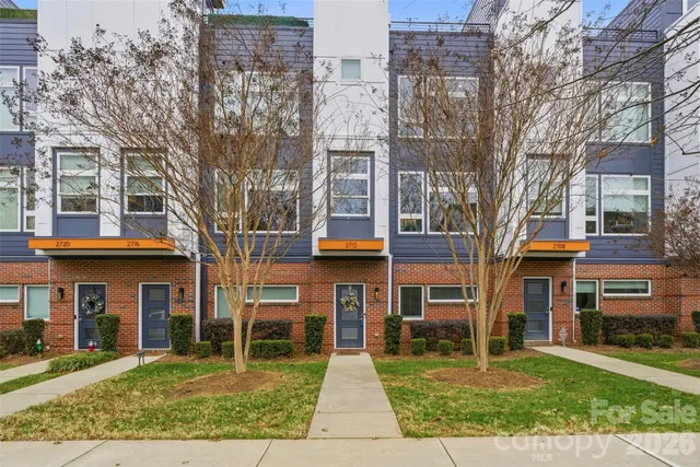 a view of entryway and gallery with wooden floor
