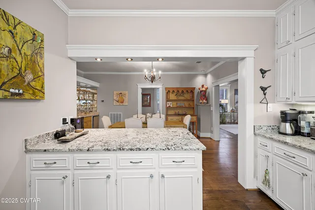 a kitchen with stainless steel appliances granite countertop a sink and cabinets