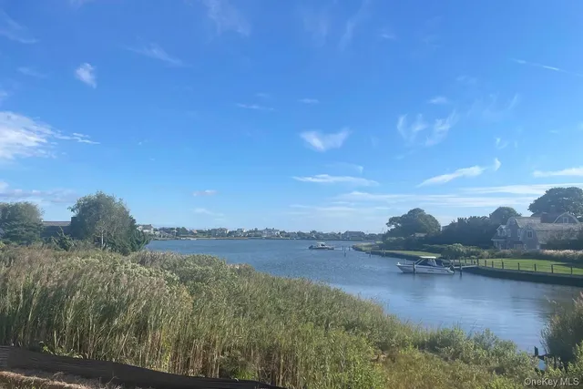 a view of a lake with sitting area and lake view