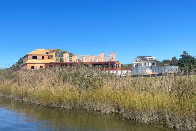 a view of a large building with a lake in front of it