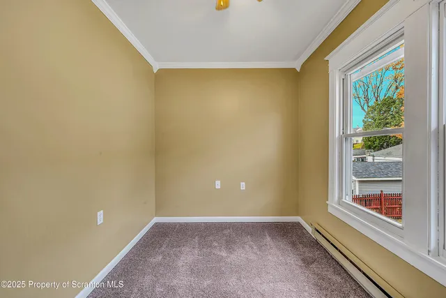 a view of a big room with windows