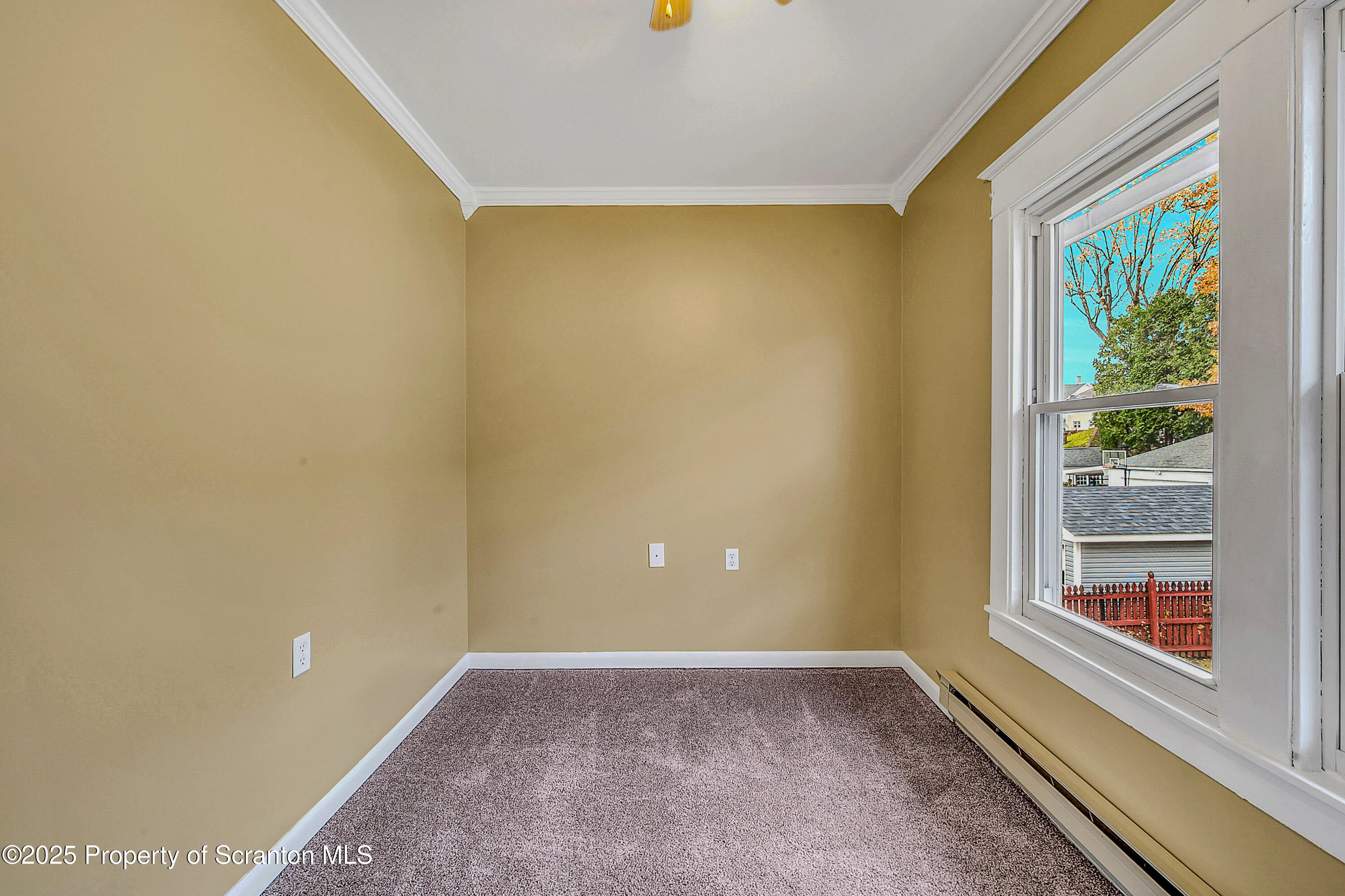 a view of a big room with windows