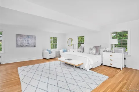 a bedroom with double bed and a window