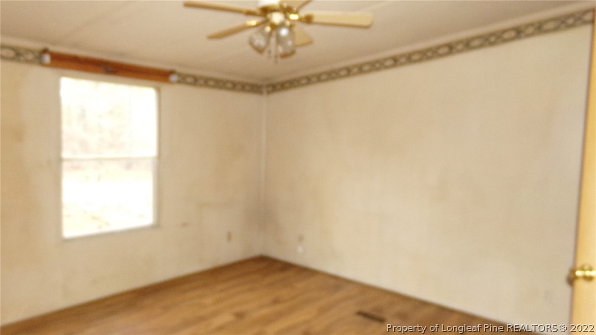 128 Dodson Road Rockingham, NC 28379 - Photo 16 of 25 a view of an empty room with a window