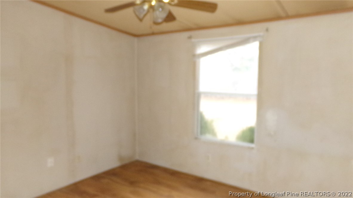 128 Dodson Road Rockingham, NC 28379 - Photo 18 of 25 an empty room with a window