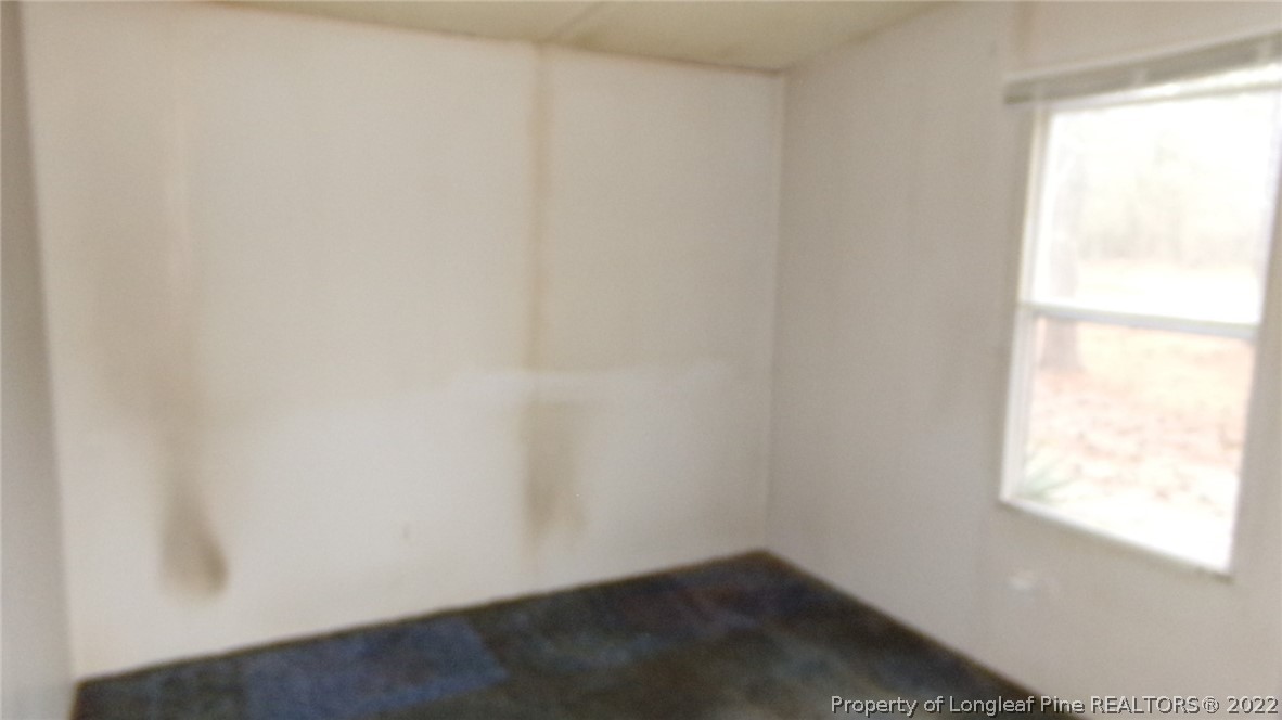 128 Dodson Road Rockingham, NC 28379 - Photo 19 of 25 an empty room with a window