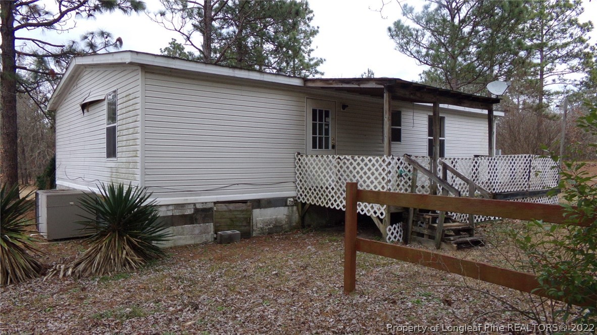 128 Dodson Road Rockingham, NC 28379 - Photo 4 of 25 a view of a house with backyard and sitting area