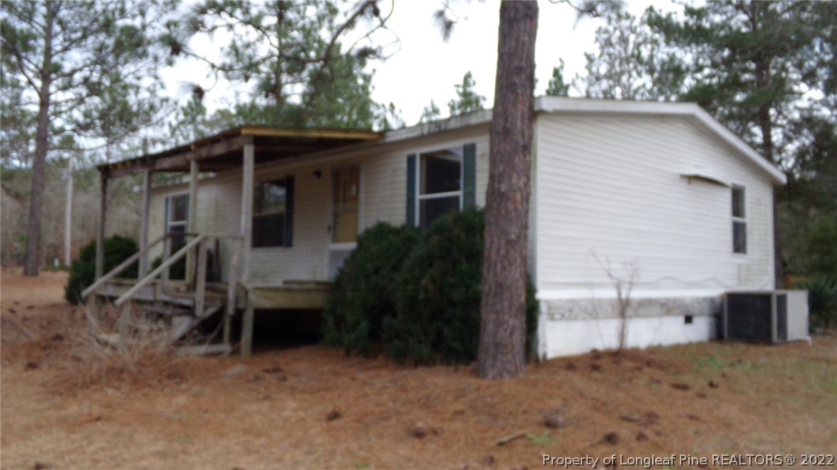 128 Dodson Road Rockingham, NC 28379 - Photo 6 of 25 a backyard of a house with table and chairs