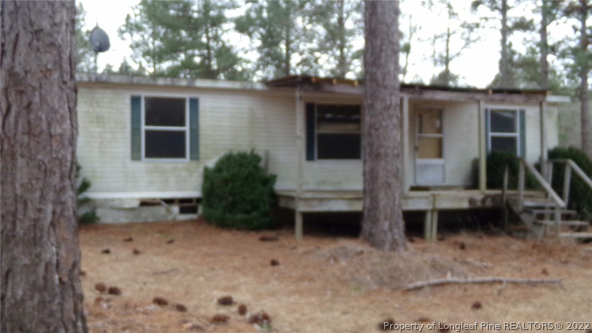 128 Dodson Road Rockingham, NC 28379 - Photo 8 of 25 a view of a house with a yard