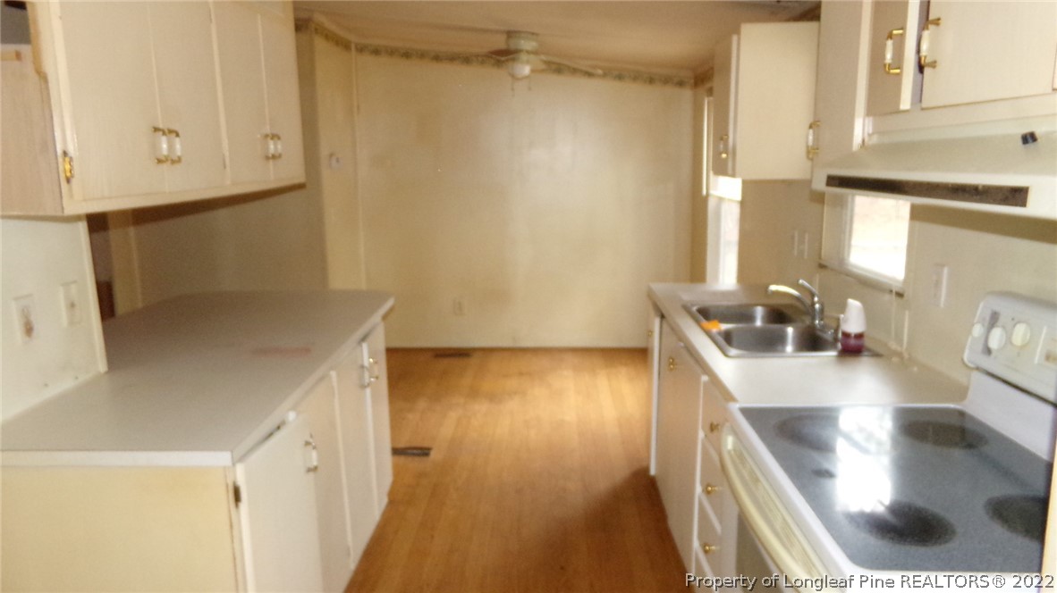 128 Dodson Road Rockingham, NC 28379 - Photo 9 of 25 a view of a kitchen cabinets and a counter top space