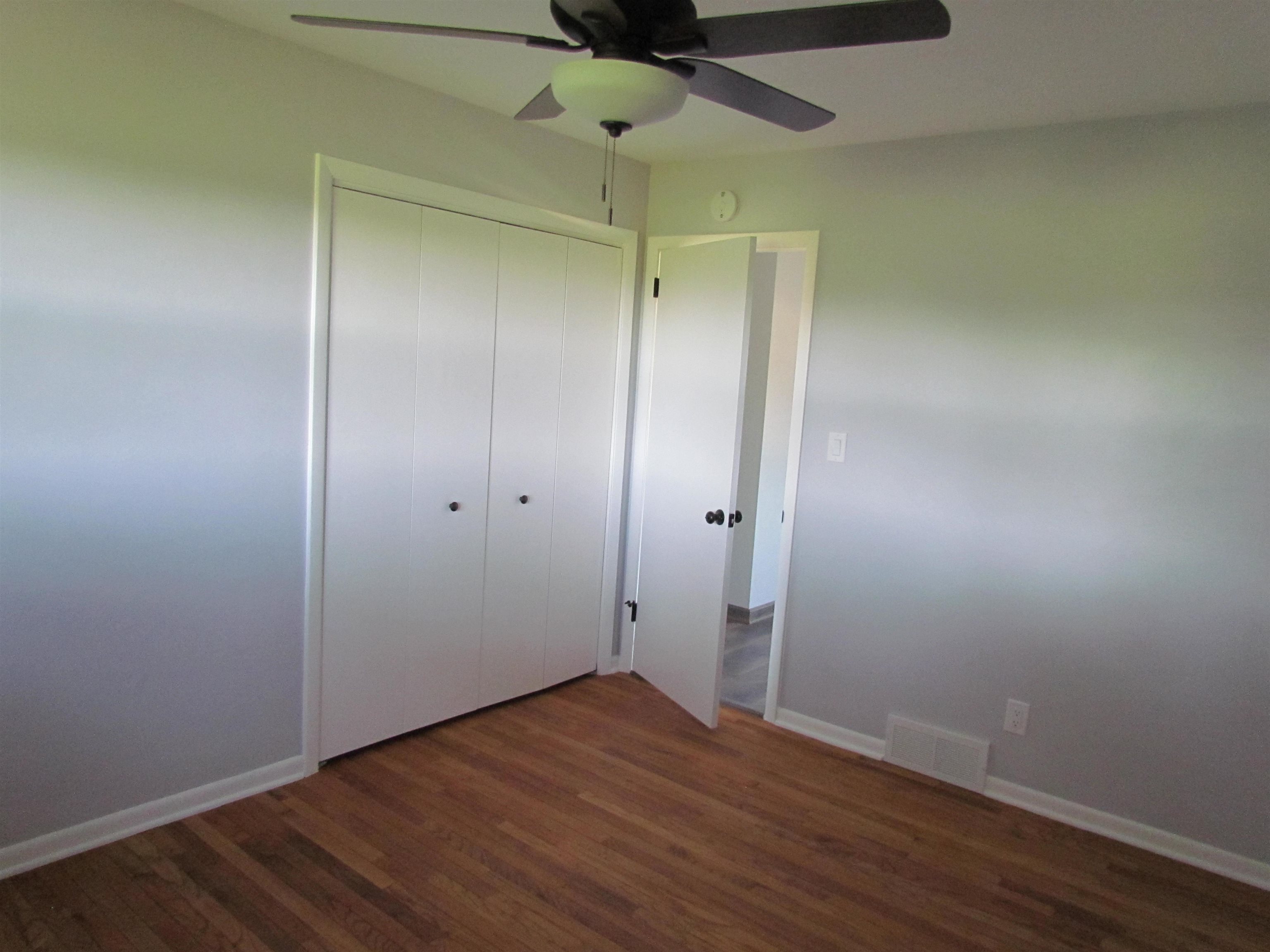 2475 North Pecatonica Road Pecatonica, IL 61063 - Photo 17 of 36 a view of an empty room with wooden floor
