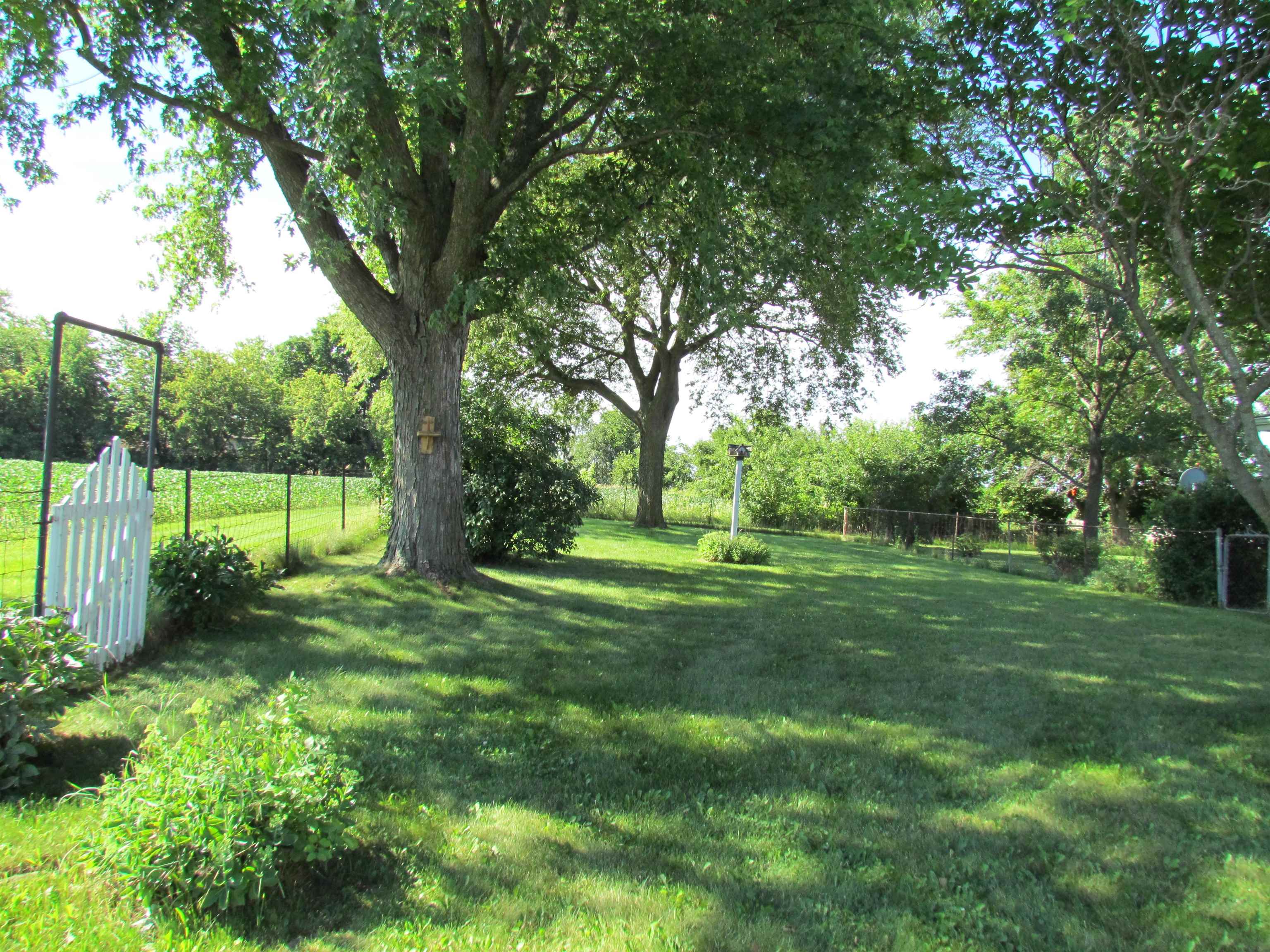 2475 North Pecatonica Road Pecatonica, IL 61063 - Photo 2 of 36 a view of grassy field with trees