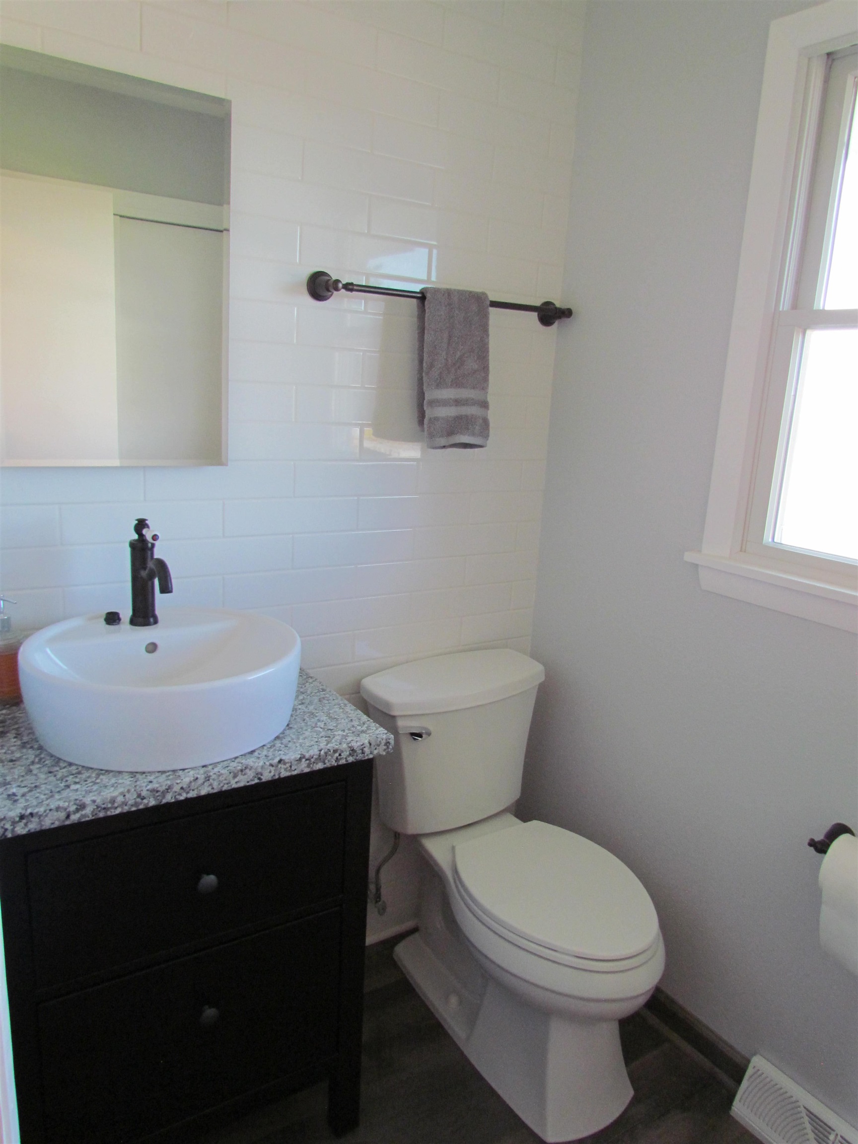 2475 North Pecatonica Road Pecatonica, IL 61063 - Photo 24 of 36 a bathroom with a granite countertop toilet sink and mirror