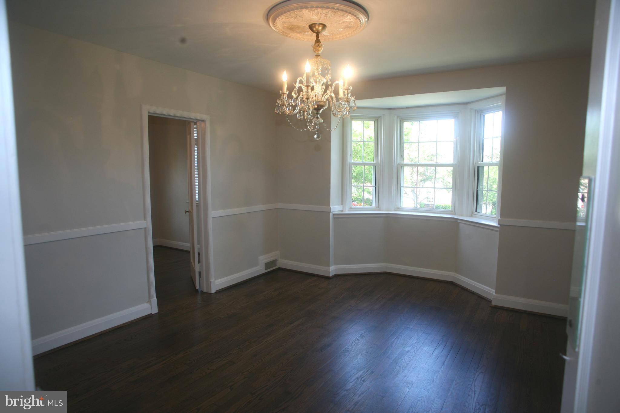 2 Dunmore Road Baltimore, MD 21228 - Photo 2 of 21 Dining Room w/ bay window & classic light fixture