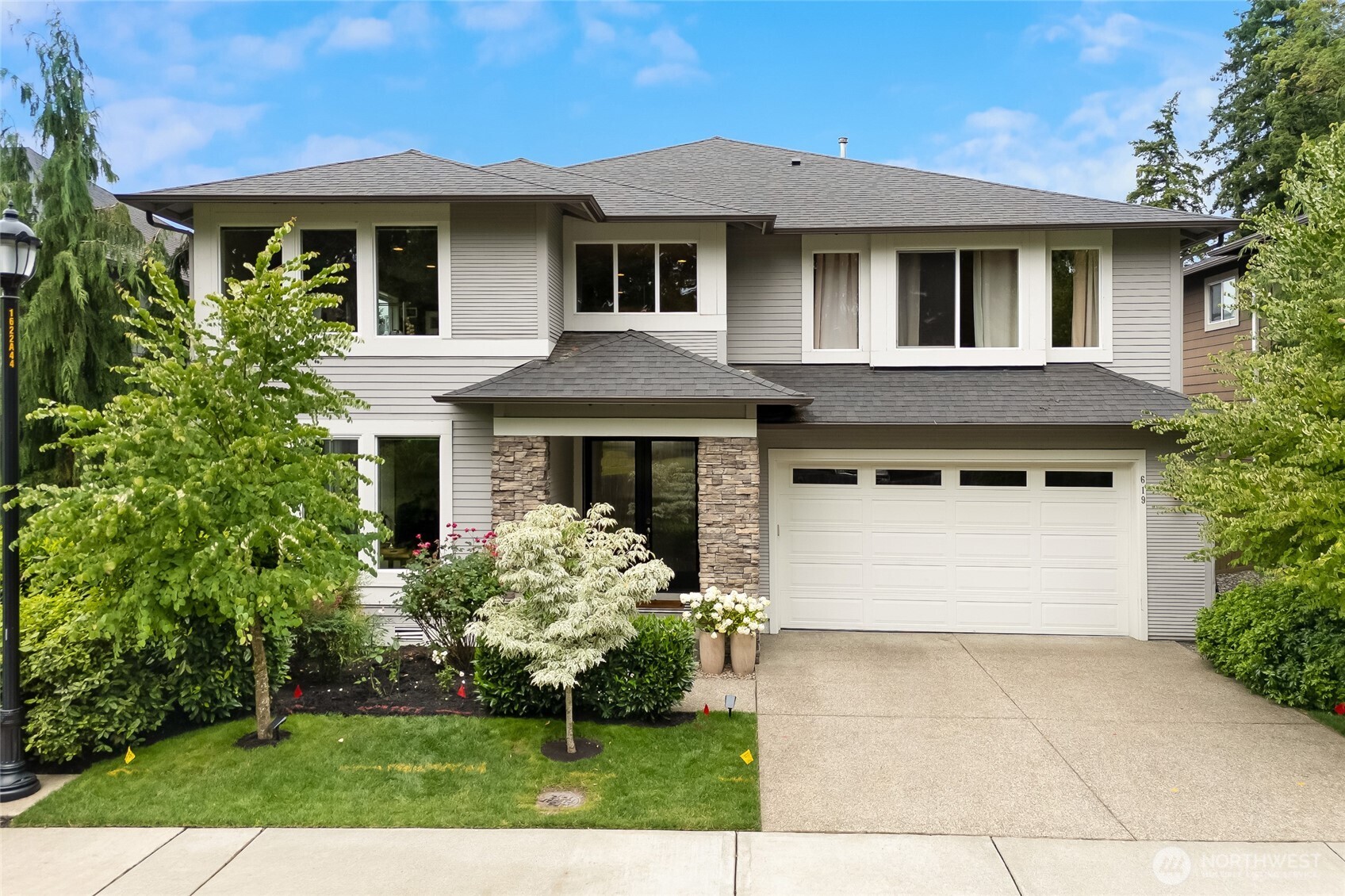 a front view of a house with a yard